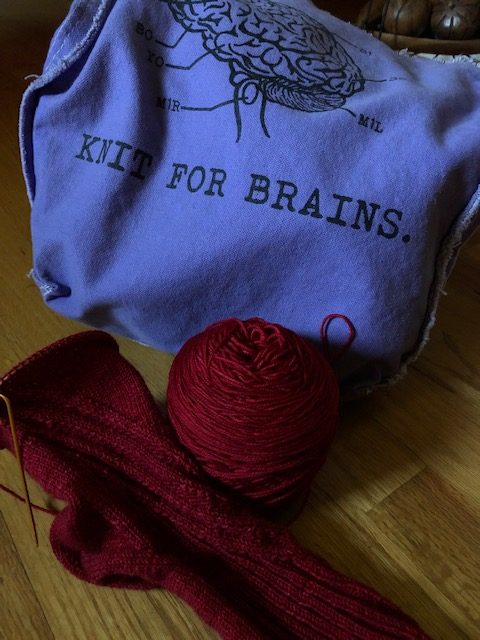 red hand-knit wool sock in progress