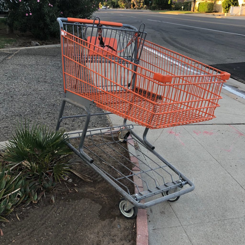 abandoned orange shopping cart